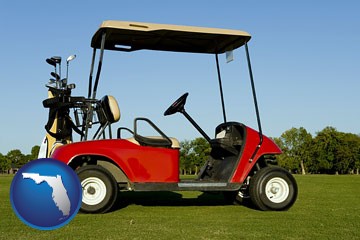 a red golf cart and golf clubs on a golf course - with Florida icon