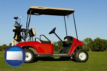 a red golf cart and golf clubs on a golf course - with South Dakota icon